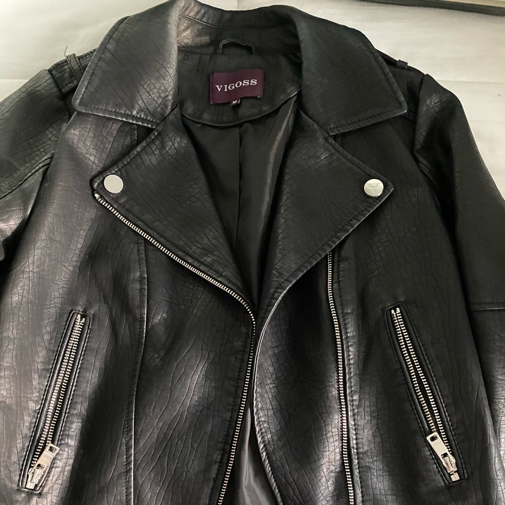 Black leather jacket with braided detail on side!
